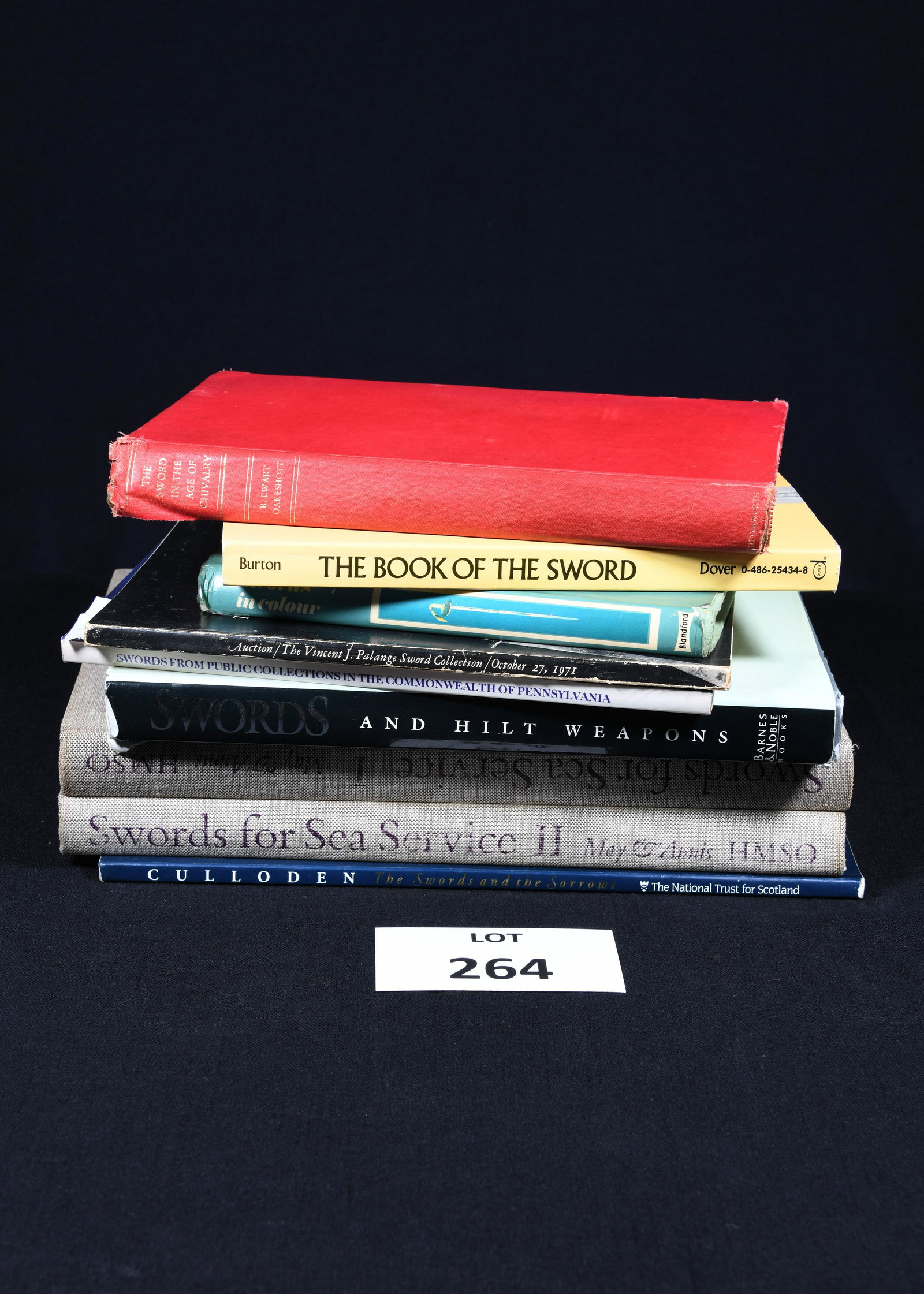 Collection of Vintage Books Relating to Swords: A nine book lot on sword collecting and history. Several catalogs from sword auctions as well as a set of Swords for Sea Service (Vol. 1 & 2). *notes- wear to covers, pages may have some discoloration