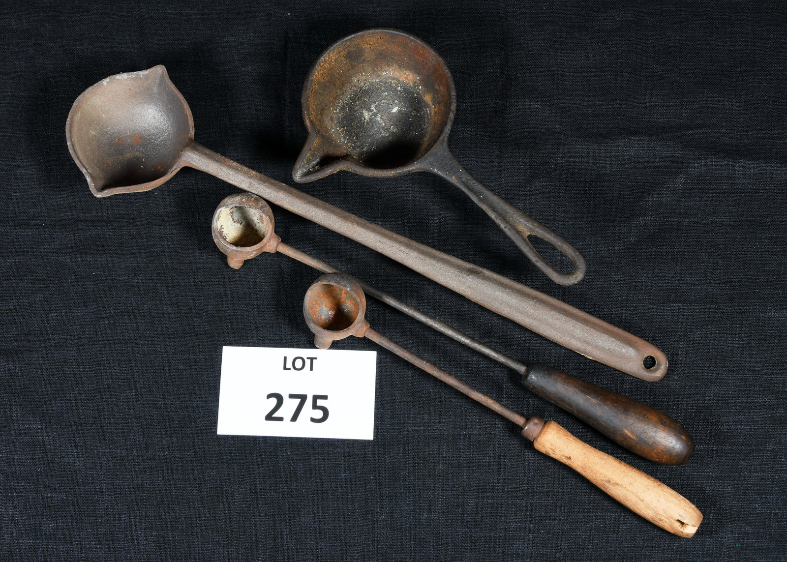 Antique Ladles For Bullet Making: Lot of 4 antique lead pouring ladles for bullet making. Made of cast iron. Two have wooden handles. Longest ladle is 15" long. *notes- all have rusting and wear from age.