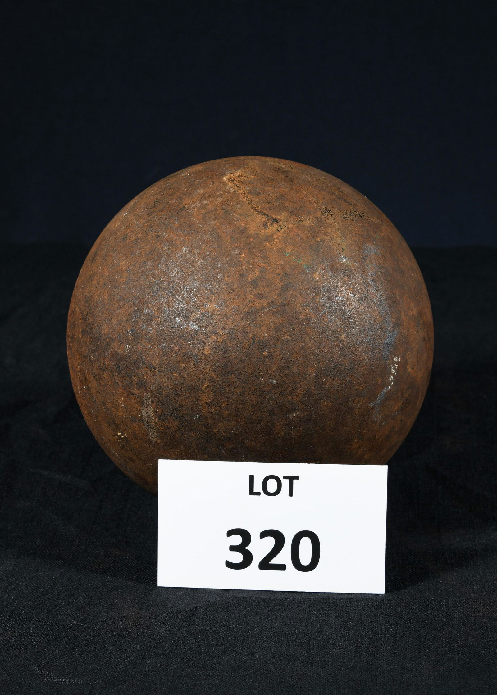 Revolutionary War Era Cannonball: An antique Revolutionary War era cannonball used on a ship cannon. This piece weighs 34 pounds and is about 6" in diameter.