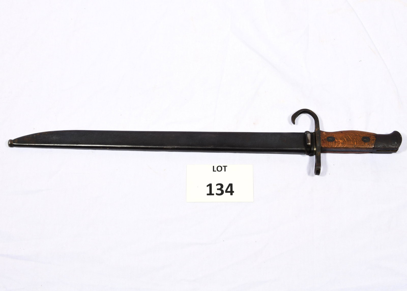 WWII Japanese Toyoda Type 30 Bayonet: A WWII Japanese Toyoda type 30 bayonet with scabbard and frog. This bayonet fits Japanese T30, T38, and T99 rifles as well as others. Blade is marked with the 4 circle Toyoda symbol. This bayonet has