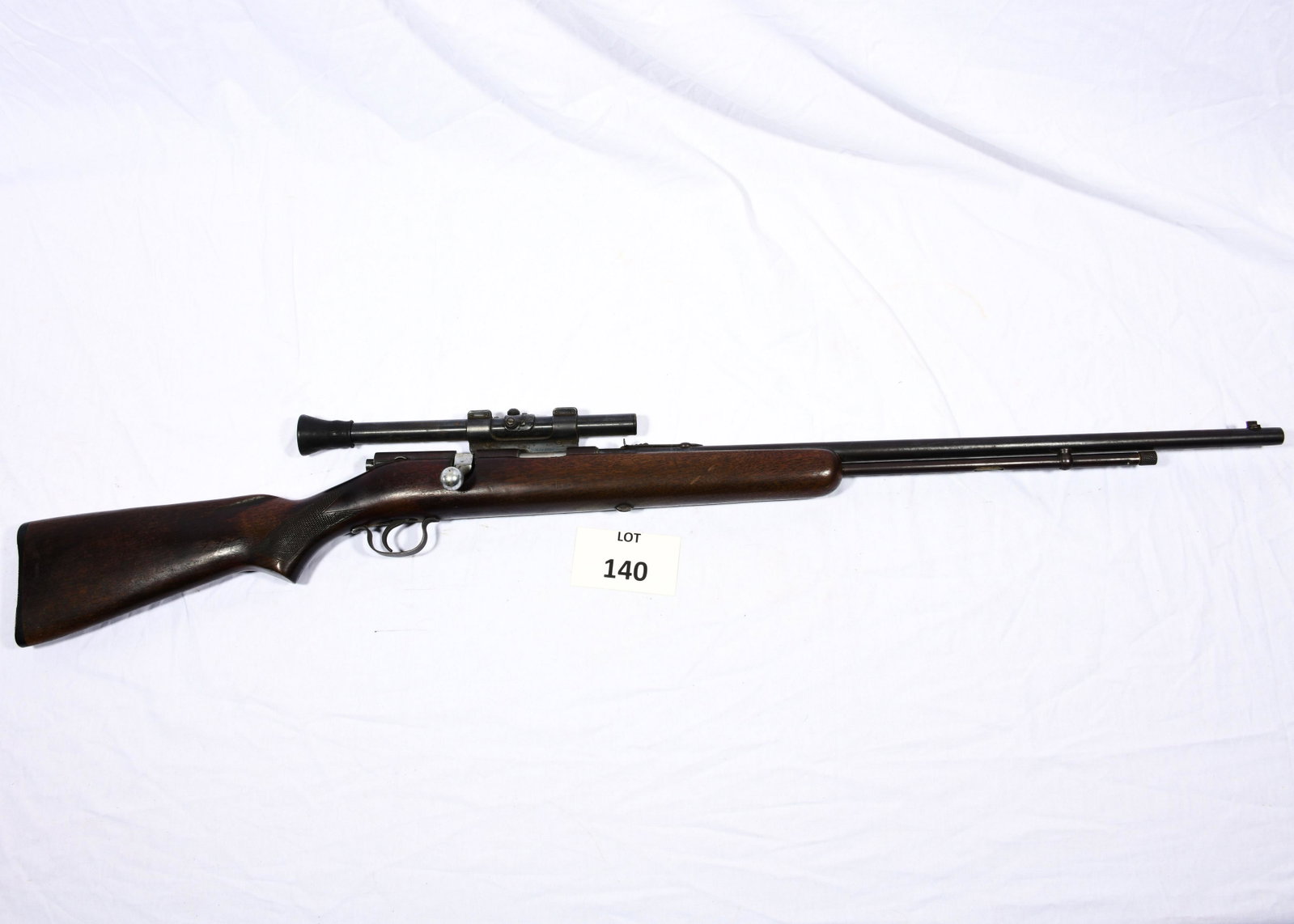 Savage Model 5 Bolt Action Rifle: A Savage model 5 bolt action rifle chambered for .22 short, long and long rifle. Has Weaver G4 scope. 43" total length. *notes- wear and scratching from age and use.