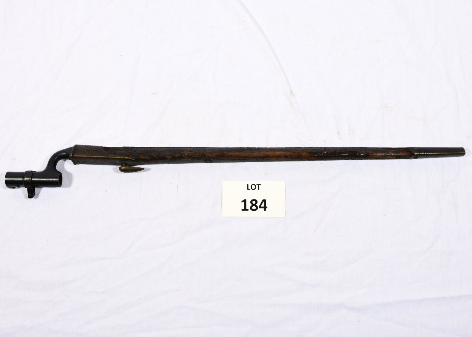 British Socket Bayonet: A British socket bayonet pattern 1895 with scabbard. Has triangular blade. Crown "BR 33" marked on blade. 26" long. *notes- wear from age and use.
