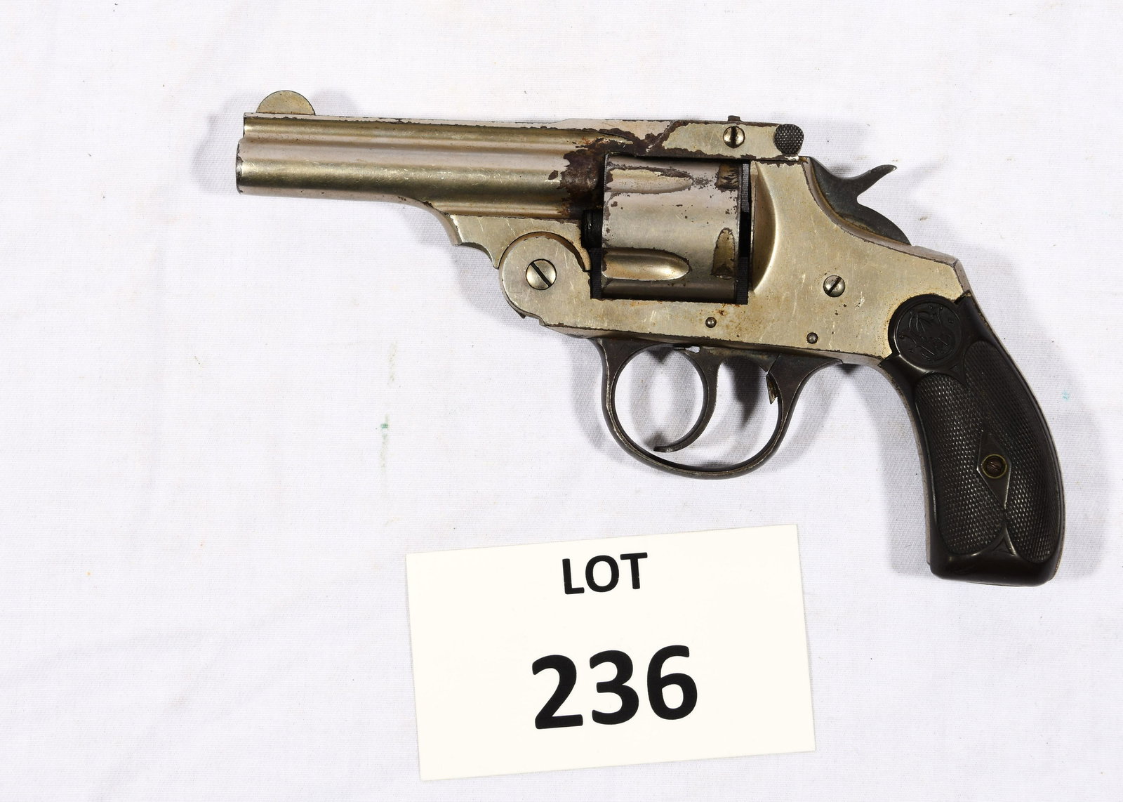 Iver Johnson Arms and Cycle Works 38 Cal.: An Iver Johnson Arms and Cycle Works 38 cal. One grip is broken at the base. Pat. date August 25, 1896. Serial # 22168. Finish is in fair condition. 6 1/2" long.