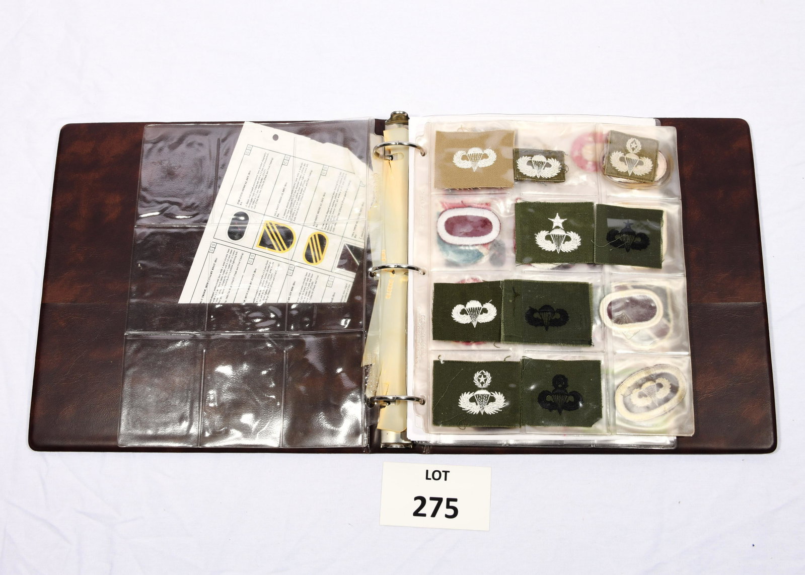 Collection of Vintage WWII Era US Military Patches: A large collection of vintage WWII era US military patches. This group features many paratrooper patches as well as patches relating to medical service. 64 patches in all. Binder measures 11 1/2" x 11