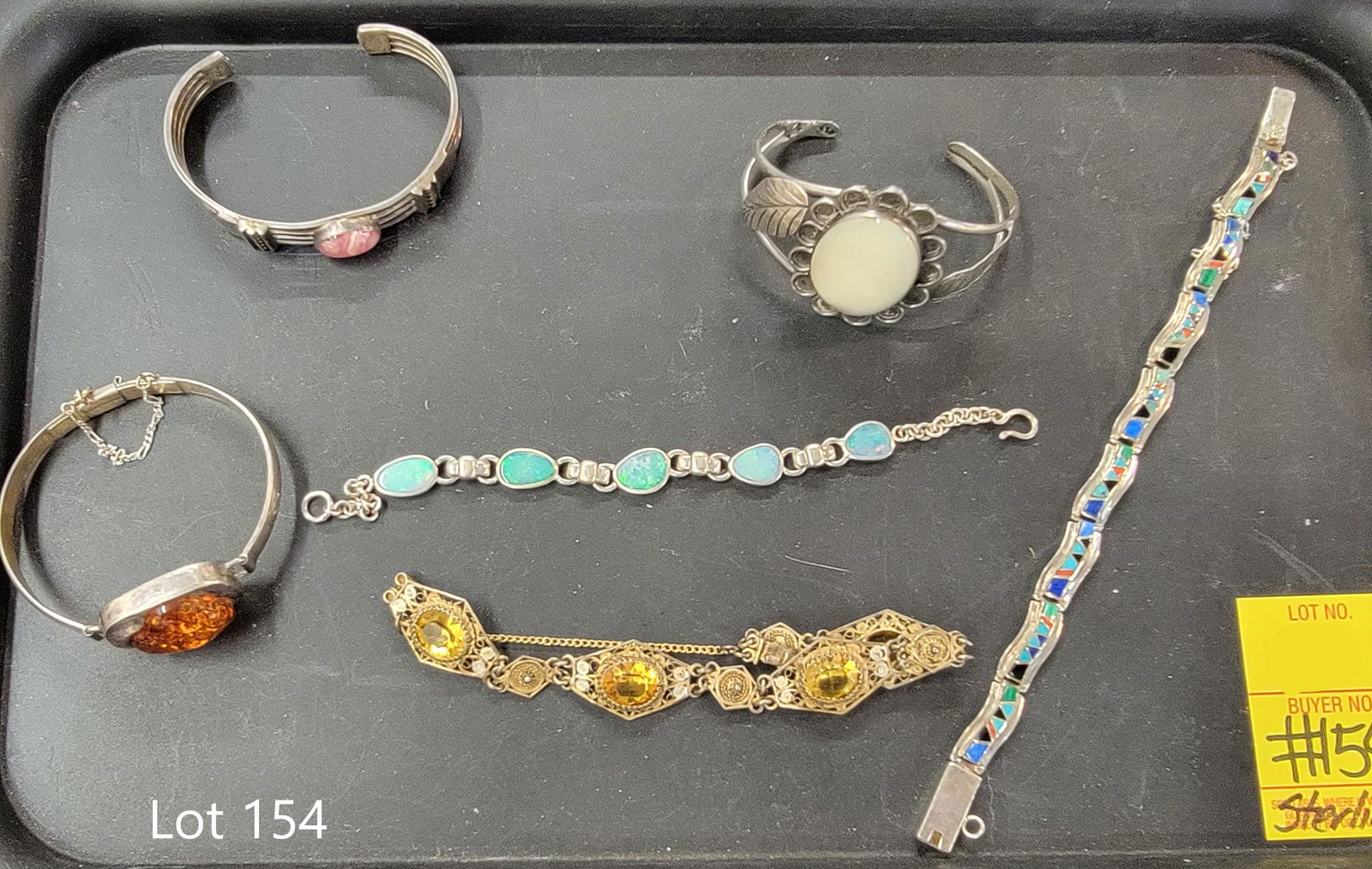 Sterling Silver Bracelet Collection: A beautiful selection of sterling silver bracelets. Includes three cuff bracelets with amber, opal and rhodochrosite stones. Also included are opal and citrine stone bracelets as well as a southwester