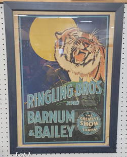 Vintage Ringling Bros and Barnum & Bailey Framed Poster: A vintage Ringling Bros and Barnum & Bailey framed poster. This poster depicts a roaring tiger with a glowing moon in the background. A small globe at the bottom right reads "The Greatest Show on