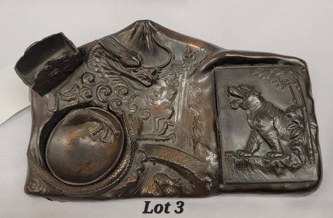 Antique Bronze Smoking Tray: An antique bronze smoking tray/desk set with a carved dragon motif and tiger motif. This tray has a storage space for cigarettes with lid, a small removable ashtray and a place to hold a box of matche