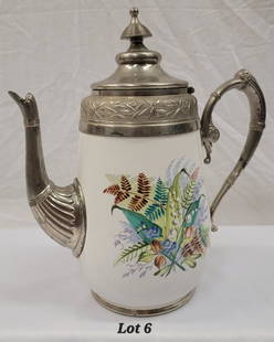 Antique Victorian Manning and Bowman Co. Coffee Pot: An antique victorian graniteware enamel coffee pot with pewter mounts and hinged lid. Painted floral motif on the front and back features ferns, lilies of the valley and other foliage. The bottom of