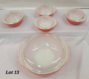 Vintage Pyrex Pink Ovenware Set: Set of four Pyrex pink ovenware dishes. Large #024 2 qt. casserole bowl with lid accompanied by four small #080 8 oz. bowls with lids.