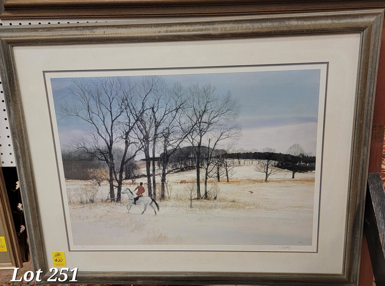 Signed Limited Edition Peter Sculthorpe Print: A signed limited edition print entitled "The Kennel Woods Fox" by Peter Sculthorpe (b. 1948). This print depicts fox running from a hunter on horseback through a wooded area with snow on the ground. S