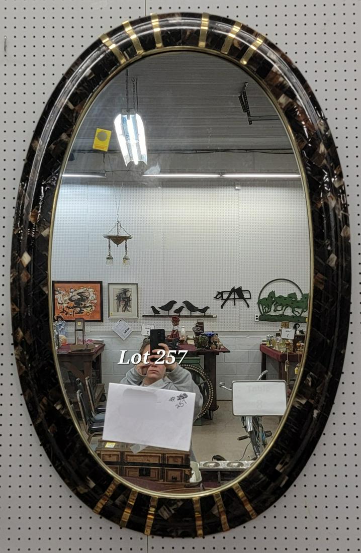 Antique Steer Bone Mirror: An large oval mirror with steer bone frame. Beautiful checkered pattern with brass accents. 51"x32".