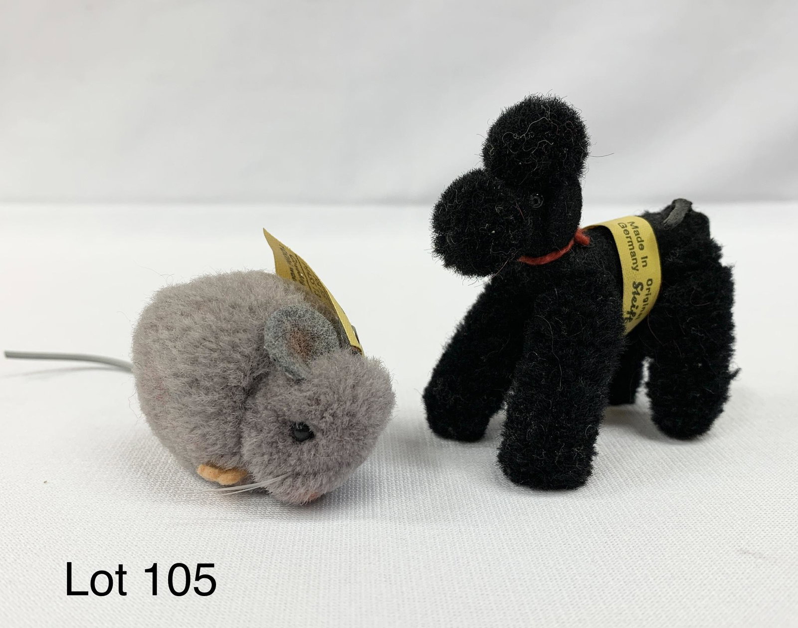 Lot of Vintage Steiff Miniature Woolen Animals: Vintage Steiff miniature gray woolen pompom mouse and black woolen snobby poodle. Both have original yellow Steiff tags. Mouse is 2" long and dog is 2 1/2" long. Made in Germany.