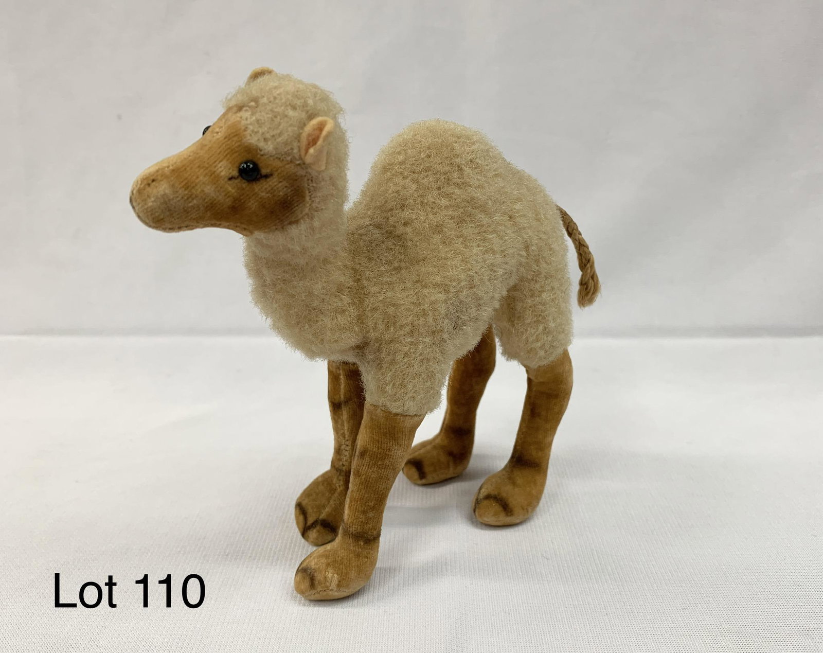 Vintage Steiff Wool Camel Doll: A vintage mid century Steiff camel with wool body made in Germany. Has black bead eyes and braided string tail. 5"x 5 1/12". Missing tags.