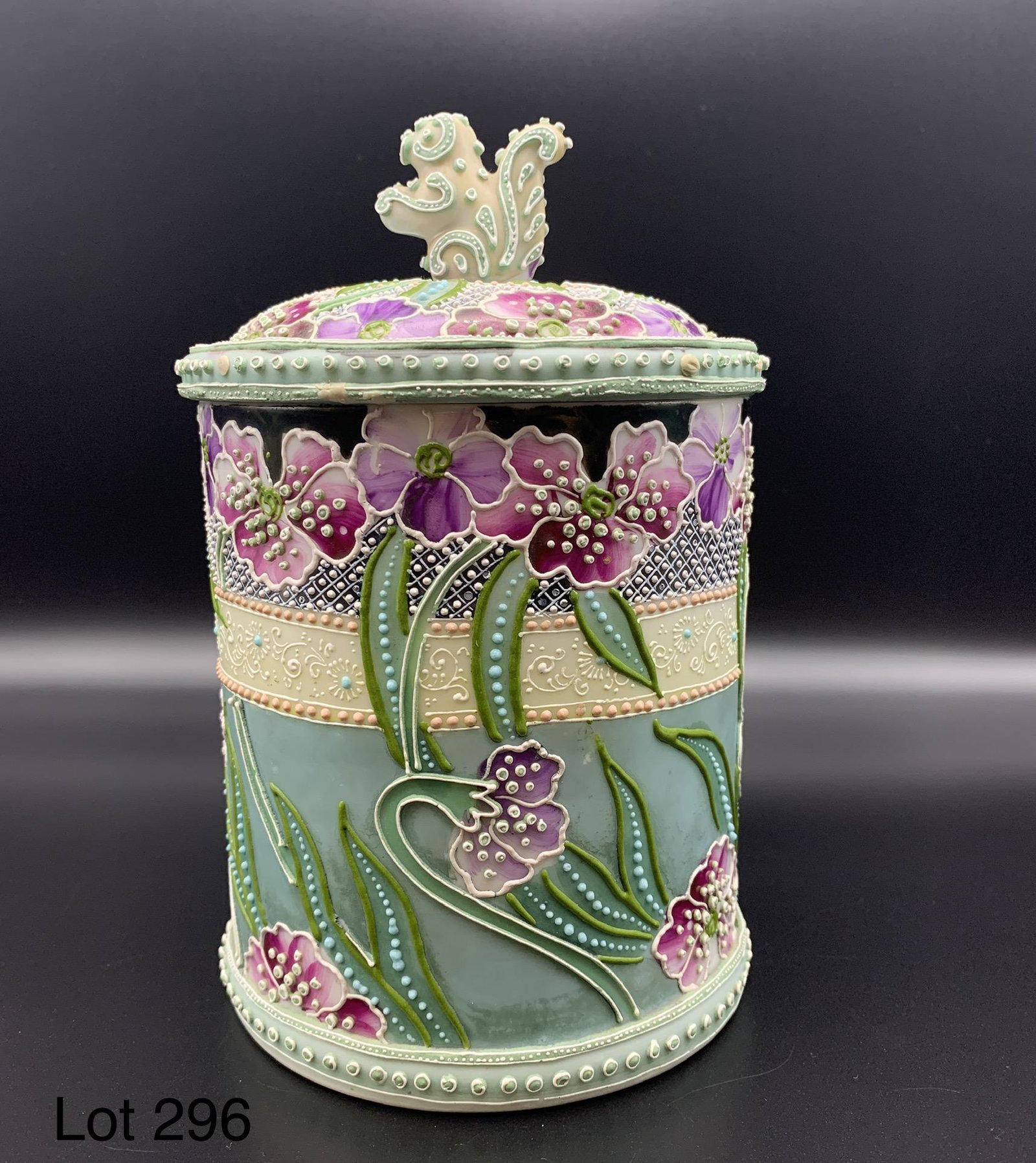 Antique Nippon Moriage Porcelain Humidor: An antique Nippon moriage porcelain cigar humidor with hand painted floral decoration and squirrel finial on lid. 7 3/4" x 4 3/4". Underside is unmarked.