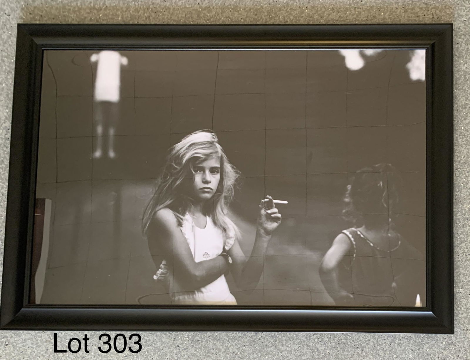 Sally Mann "Candy Cigarette": A framed print of "Candy Cigarette" by American photographer Sally Mann (b. 1951). Frame measures 40 1/4" x 28"