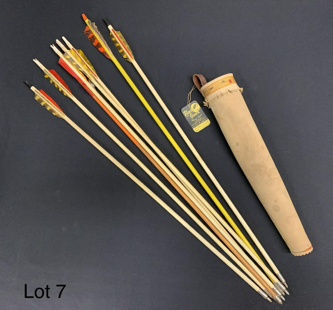 Vintage Toy Arrows with Black Hawk Holster: A group of vintage wooden toy arrows with colorful feather fletching. They are stored in a Black Hawk tan suede leather holster with original tag. Arrows are 29" long. *notes- feathers are ripped in a