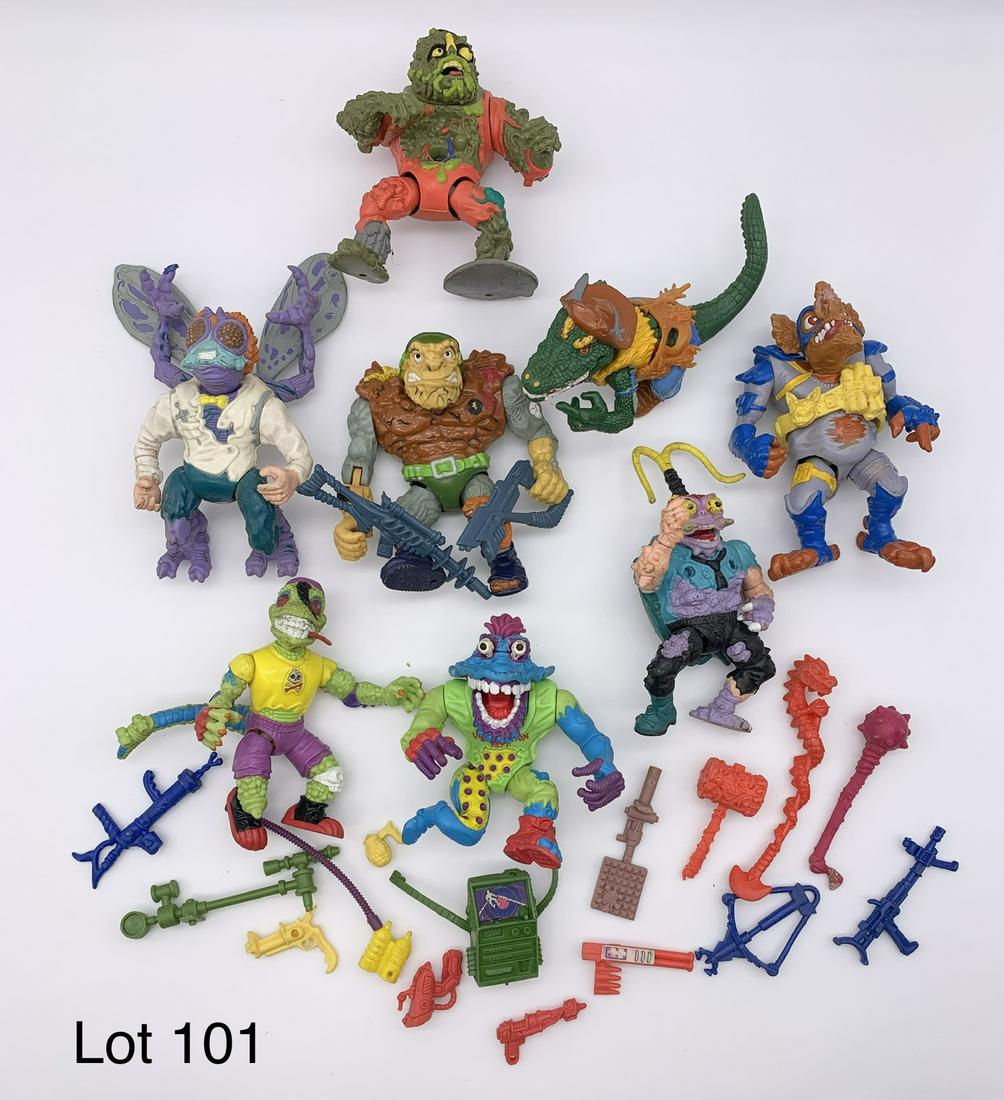 Lot of Vintage 1990's Teenage Mutant Ninja Turtles Villain Figures: A lot of eight Teenage Mutant Ninja Turtle villain action figures from the 1990's. This group includes Leatherhead, Baxter Stockman, Muckman and more. Also included are several weapons and other acces