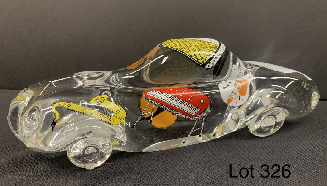 Olle Broze'n Kosta Boda limited edition glass car: Limited edition Olle Broze'n Kosta Boda glass car with musical instruments. Numbered 2 of only 50 made. 11" long, 3 1/2" tall, 3 1/2" wide.