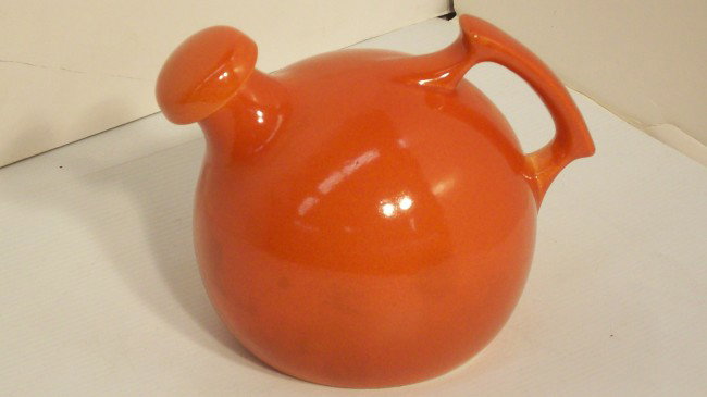 RUMRILL #50 RED WING BALL PITCHER WITH CAP: 6 1/2" tall X 7" across, Marked RumRill 50, no chips or cracks, has some staining from use, has the original cap.