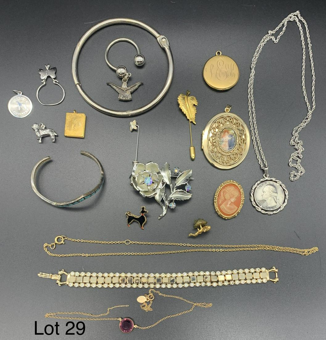 Collection of Costume Jewelry: A nice collection of costume jewelry. Includes a coin pendant necklace, a large gold toned locket and much more. *notes- necklace with purple stone has broken chain.