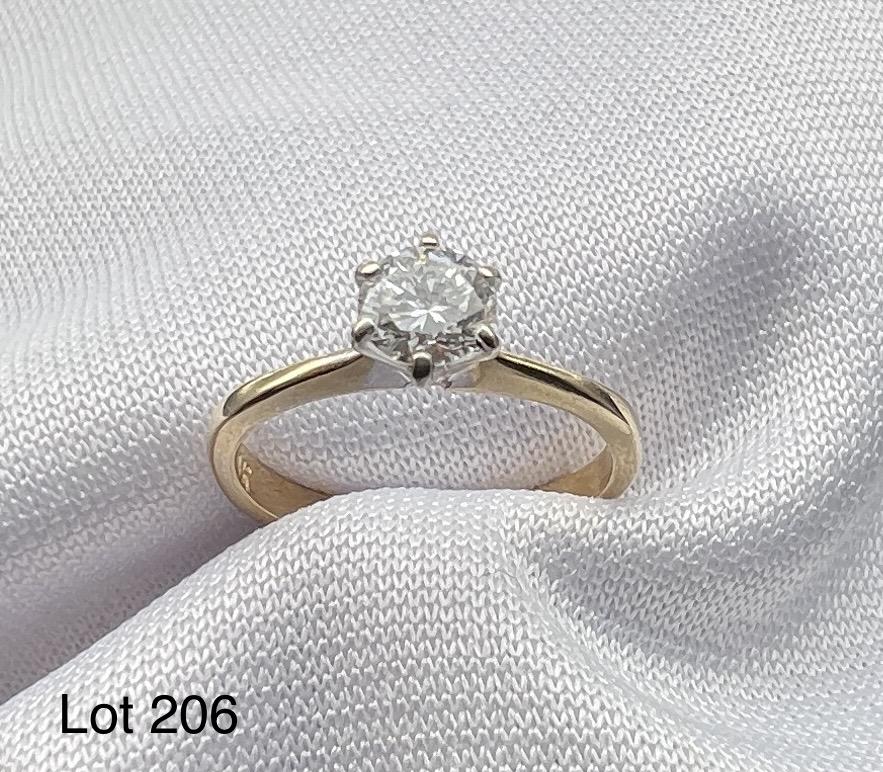14K Gold Diamond Ring: A 14K yellow gold ring with round cut 1/2 ct diamond. Size 5.