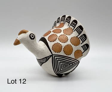 Acoma Pueblo Pottery Figurine: An Acoma Pueblo pottery figurine of a turkey made by the late and celebrated potter, Lucy Lewis. 2 1/2" x 2 1/2".