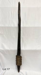 Vintage War Club: A vintage war club with carved striking section and richly patinated handle section. 30" long.