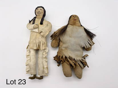 Lot of Indian Dolls: Two vintage handmade Indian dolls. Male and female with hide clothing and cloth bodies.