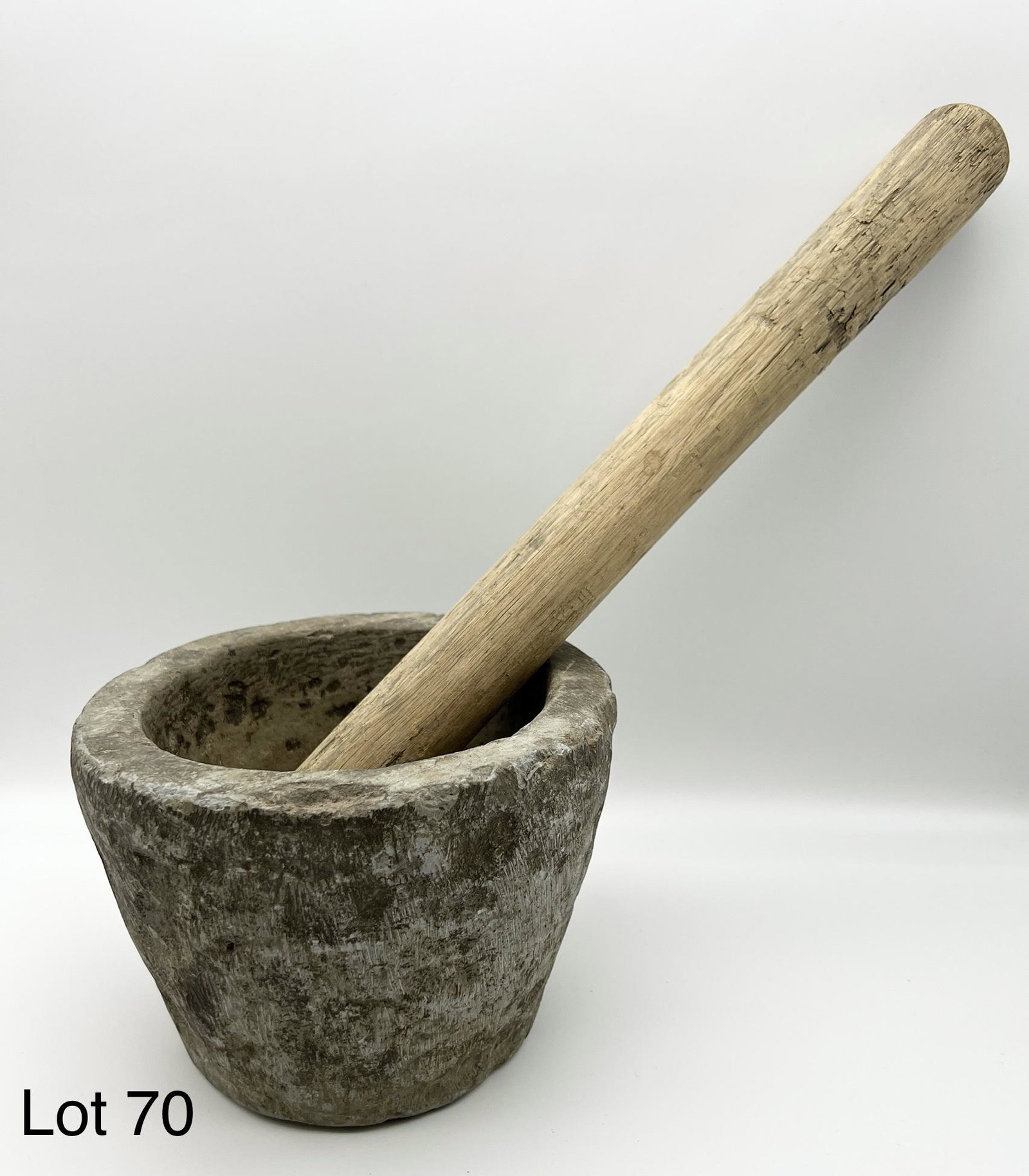 Mortar and Pestle: A stone mortar and wooden pestle. 5" x 4 3/4".