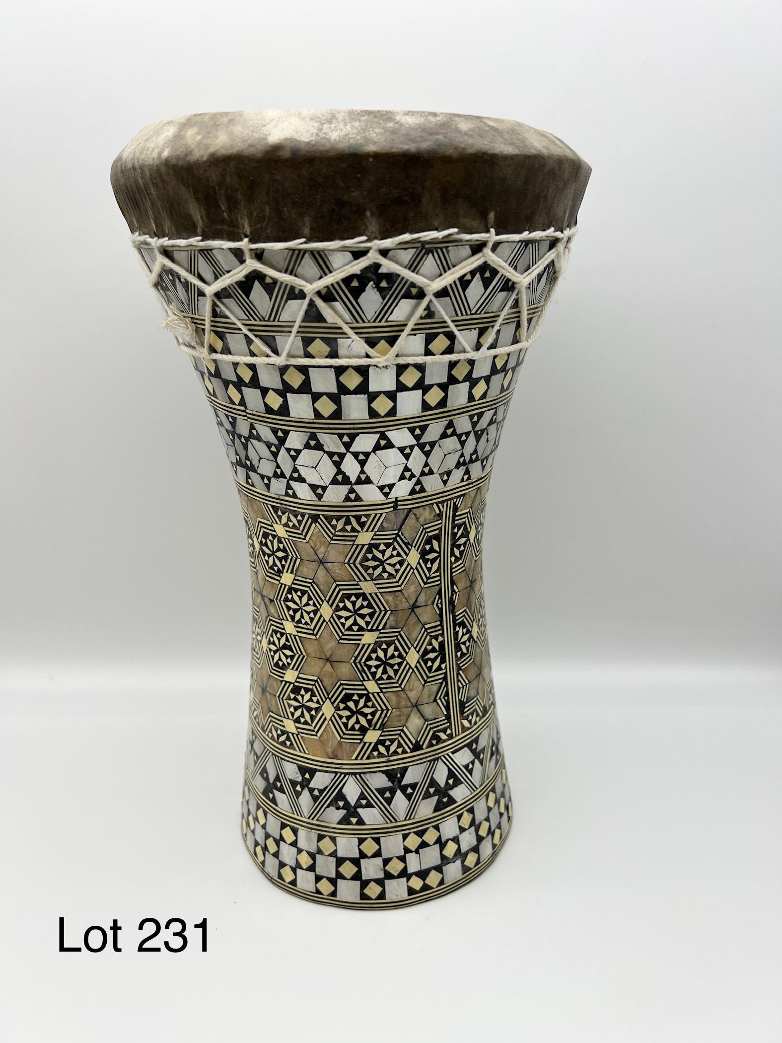 Drum With Inlaid Design: A drum with detailed inlaid mother of pearl design. Wrapped with white rope. 12" tall.