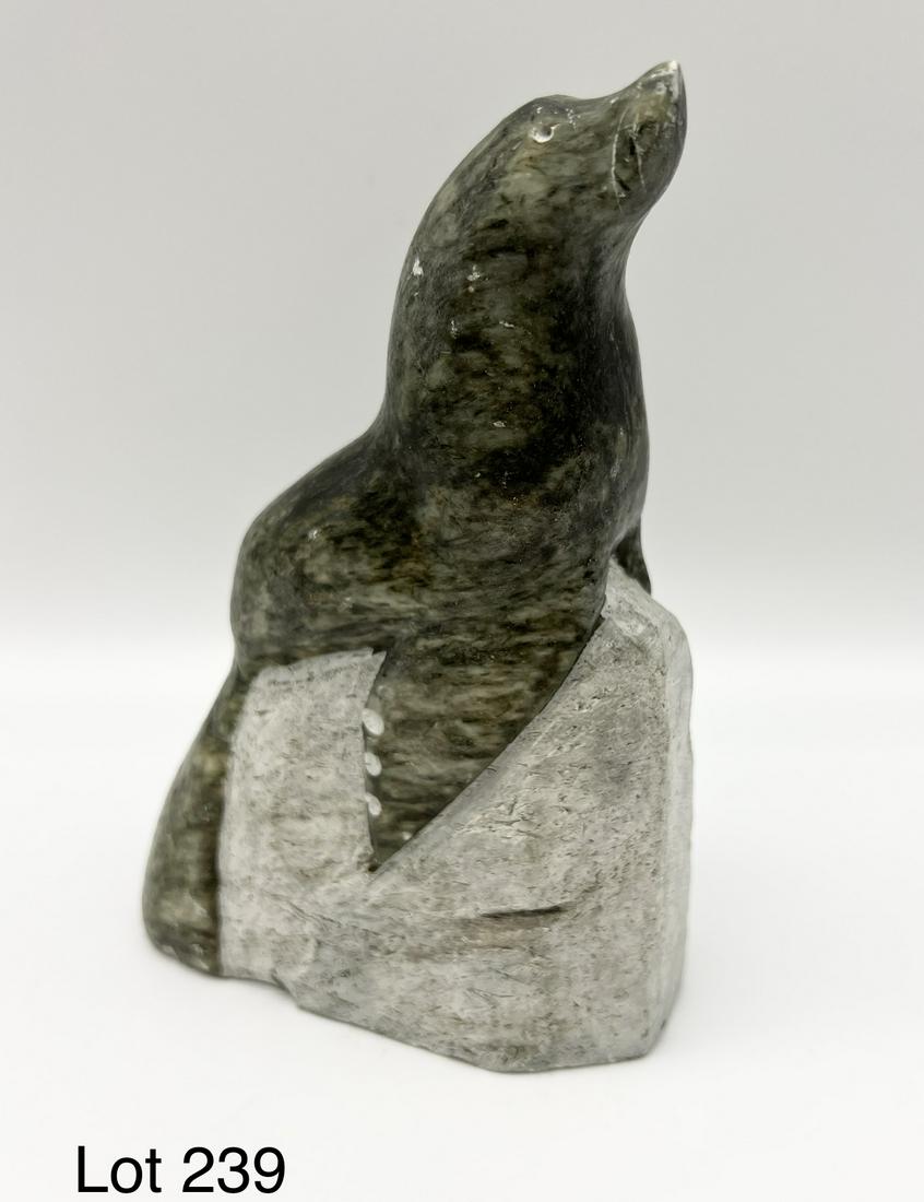 Soapstone Seal Figurine: A soapstone seal figurine. 6 1/2" tall. Underside is signed.