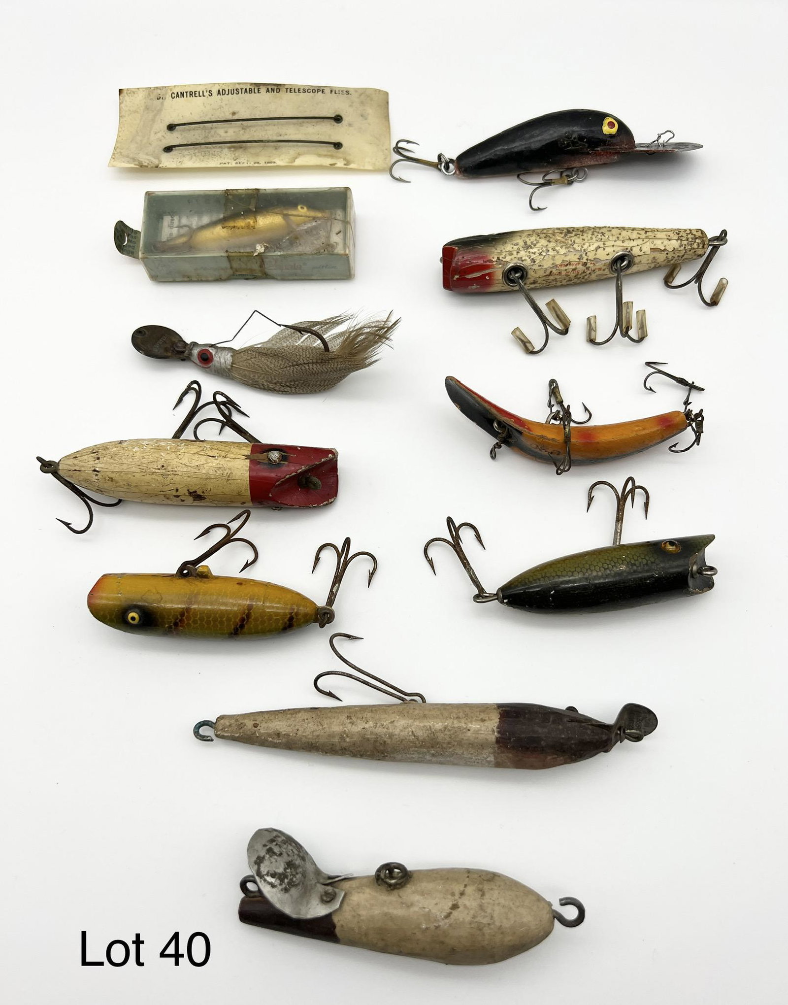 Vintage Lures and Jig: A collection of nine vintage wooden lures and one jig.