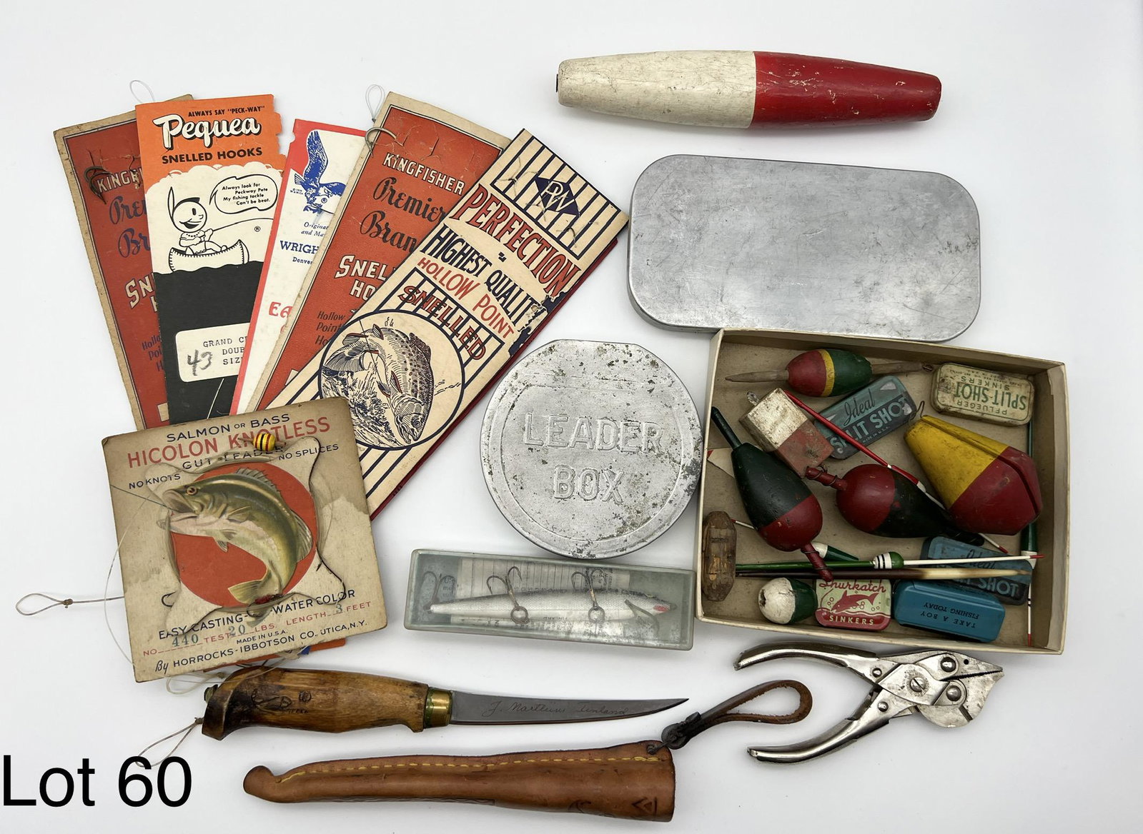 Lot of Misc. Fishing Items: A tray lot with vintage leader boxes, vintage floats, split shot sinker tins (empty), vintage Finnish made filet knife with 4" blade and sheath, Sargent's pliers and vintage snelled hook packs.