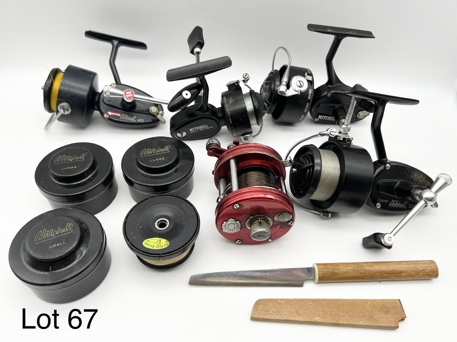 Lot of Mitchell Reels: A lot of four Mitchell reels. Includes a 300, 300A, 400, and 308A. Plus one Ambassadeur 5000 baitcasting reel and plus four extra Mitchell spools.