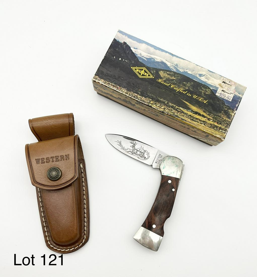 Western 532 G USA Lockback Knife: Western 532 G USA Lockback Knife. This folding knife features a 3.75" blade with a whitetail deer etching. Overall length is 7 3/8", and comes with a leather sheath. Condition is new in the box, but w