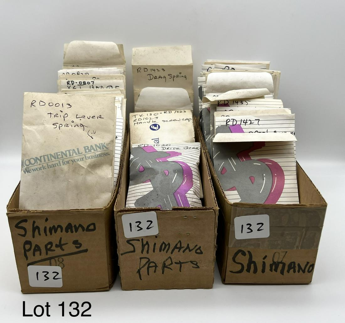 Tray Lot of Shimano Reel Parts: Tray lot of various Shimano Reel parts from a now-defunct reel repair shop. Parts include bail springs, bail arms, bail wires, handles, line rollers and more. These parts date from the 1980s and 90s.