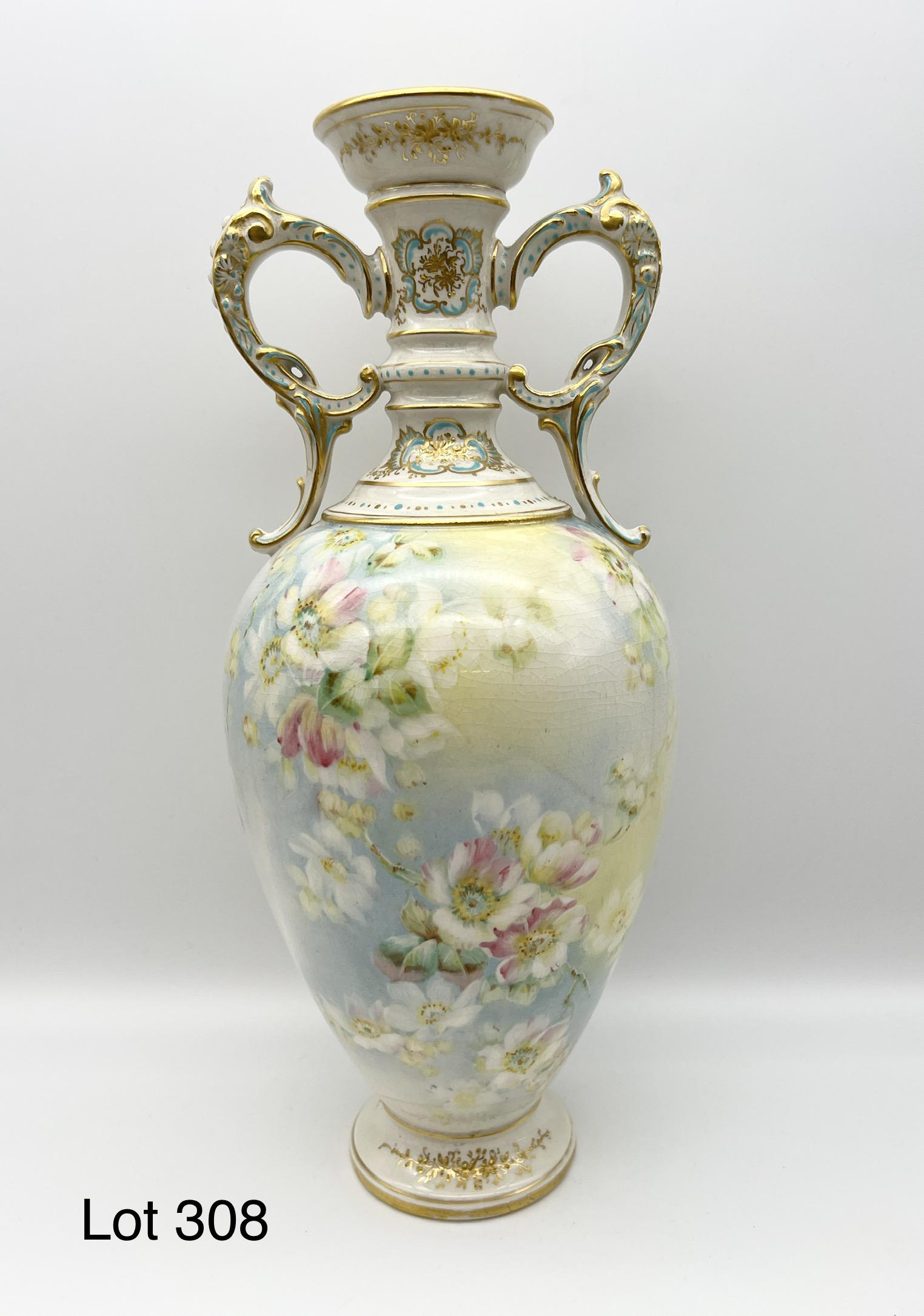 Royal Bonn Hand Painted Porcelain Vase: Royal Bonn porcelain vase with painted white flower design. Made in Germany. Makers mark on underside. Measures 12 1/2" tall.