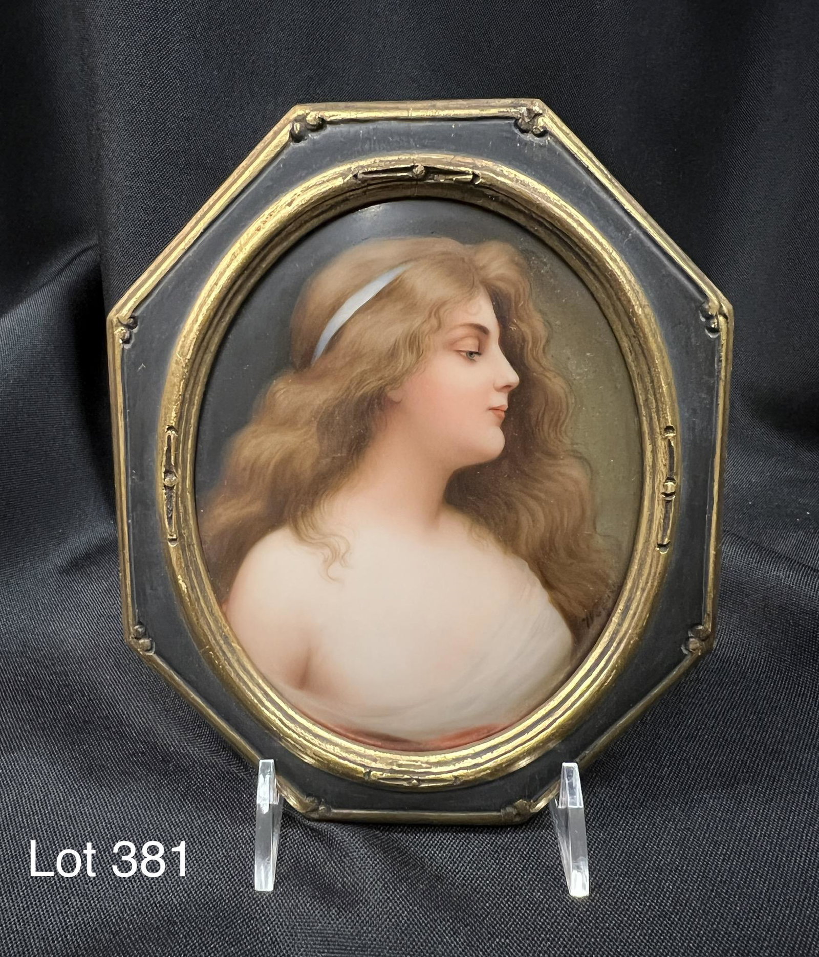 Hutschenreuther Painting on Porcelain: Hutschenreuther painting on porcelain of radiant young woman. 19th century, signed "Wagner" in lower right. In original gilded frame, measuring 6 1/4" x 5 1/4".