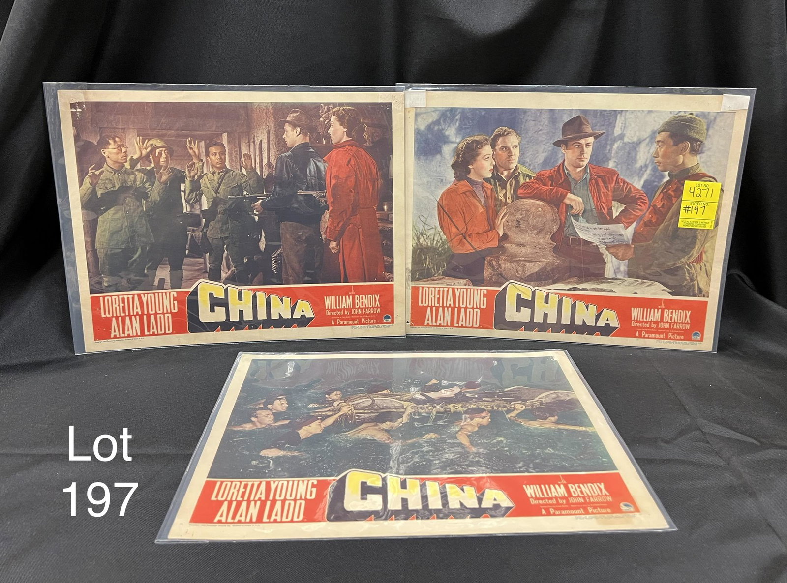 Lot of Vintage Lobby Cards for China: A trio of vintage lobby cards from the 1943 film China starring Loretta Young, Alan Ladd and William Bendix. Directed by John Farrow. Cards measures 14" x 11". *notes- wear from age, Marks on front. H