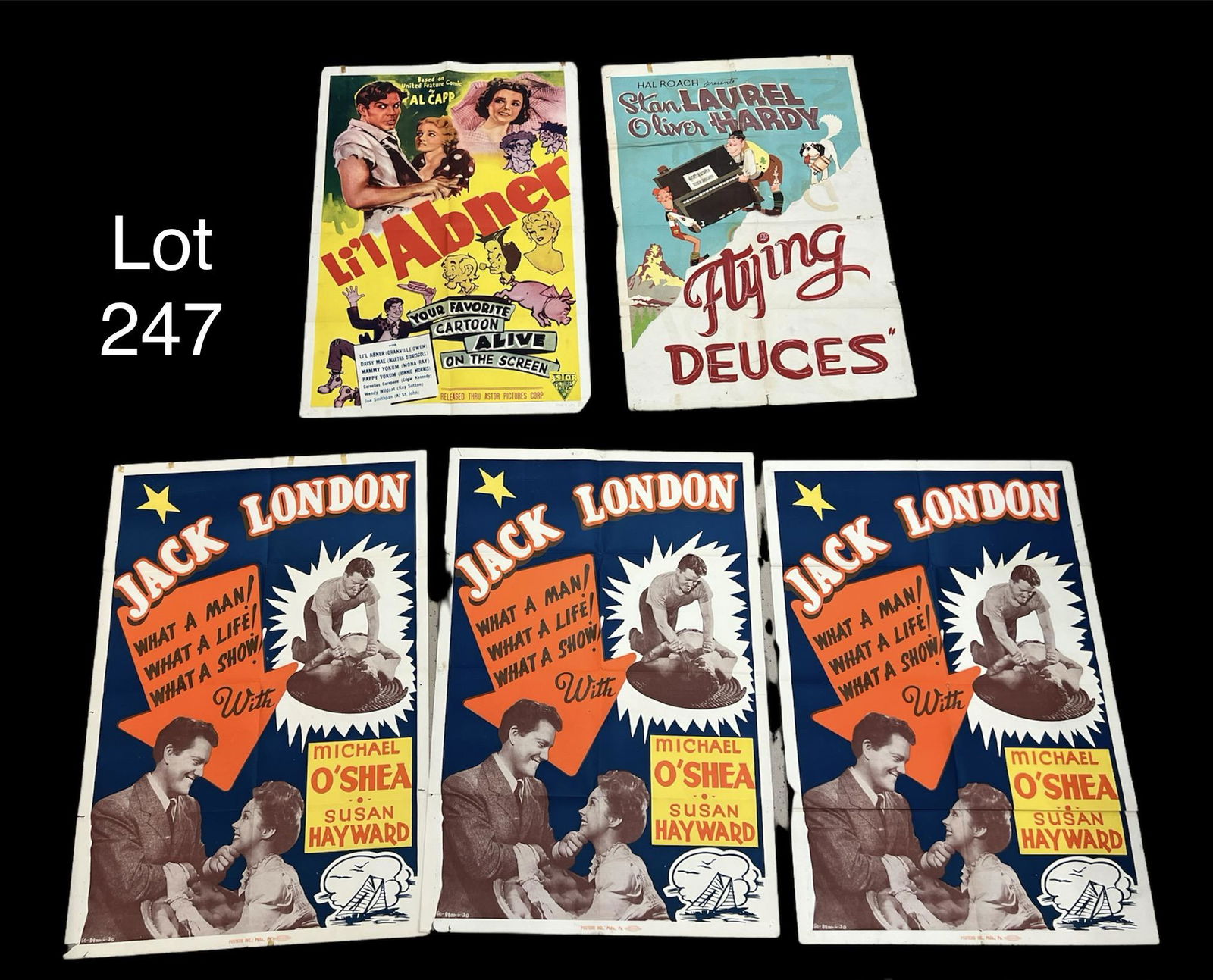 Lot of Vintage Movie Posters: Lot of five vintage movie posters, including: Li'l Abner, Laurel and Hardy's The Flying Deuces, and three for the biographical film Jack London. *note - some evidence of tearing, holes, adhesive resid