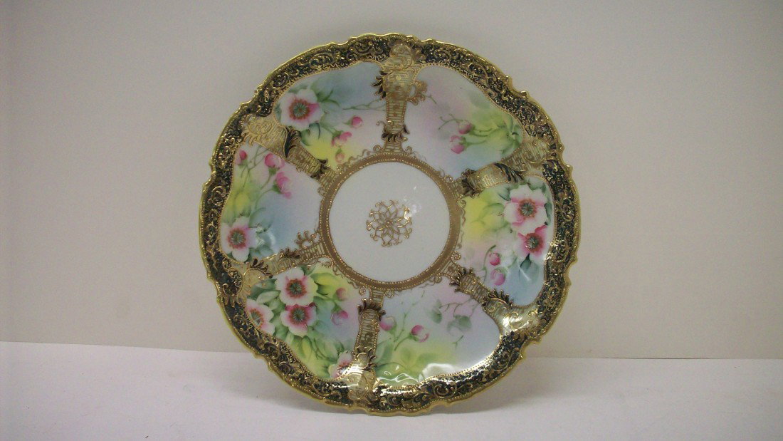 Hand Painted Nippon Gilt Moriage Plate: 10 1/4", late 19th century, hand painted flowers in gilt moriage cartouches, elaborate gilt and gilt moriage decoration and foliate rim, stamped on the base with a green maple leaf mark and read "Hand