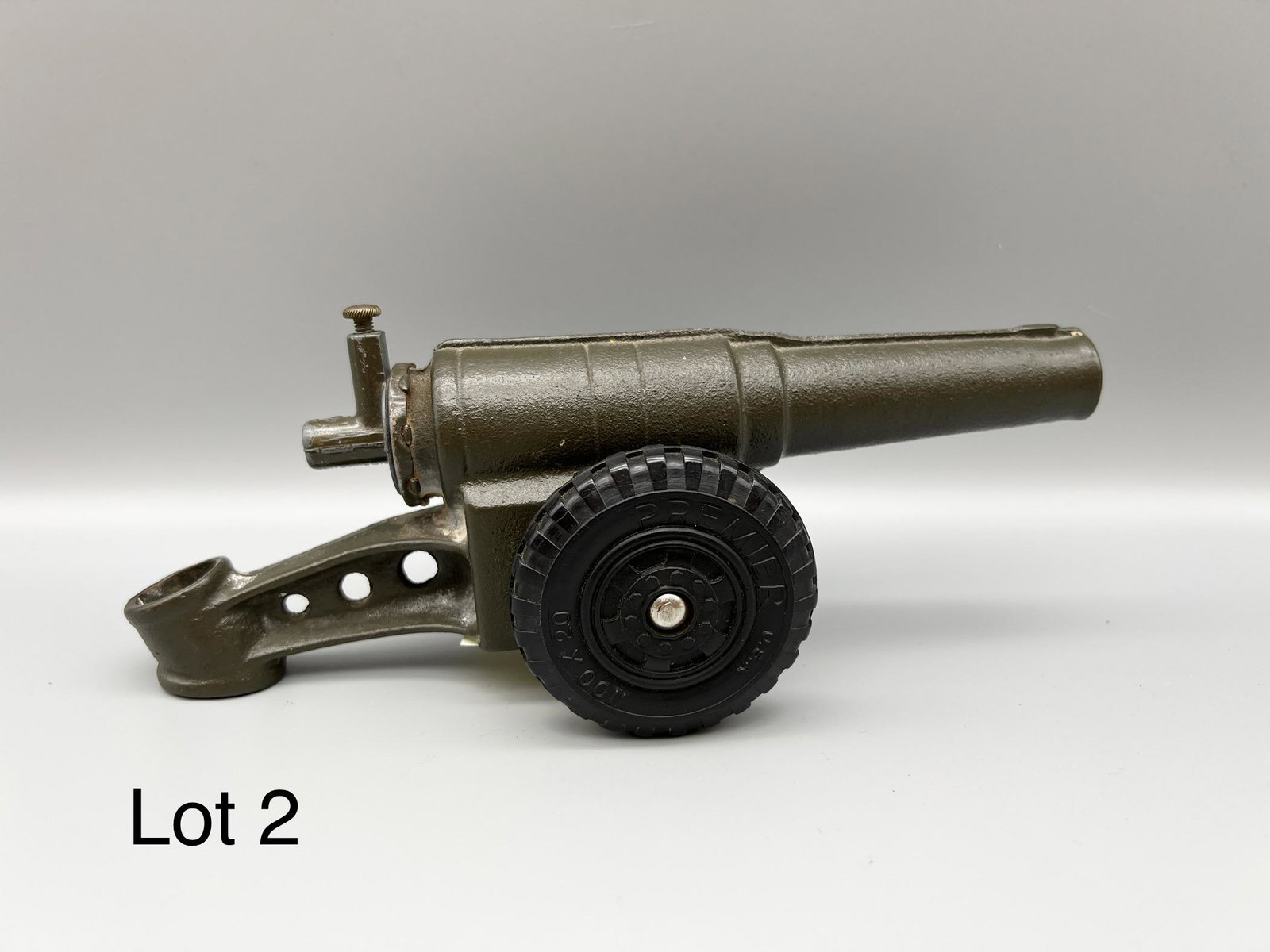 Premier Big Bang Cast Iron Cannon: Premier USA Big Bang cast iron cannon in olive green with rubber wheels, measures 9" long. *note - missing striker