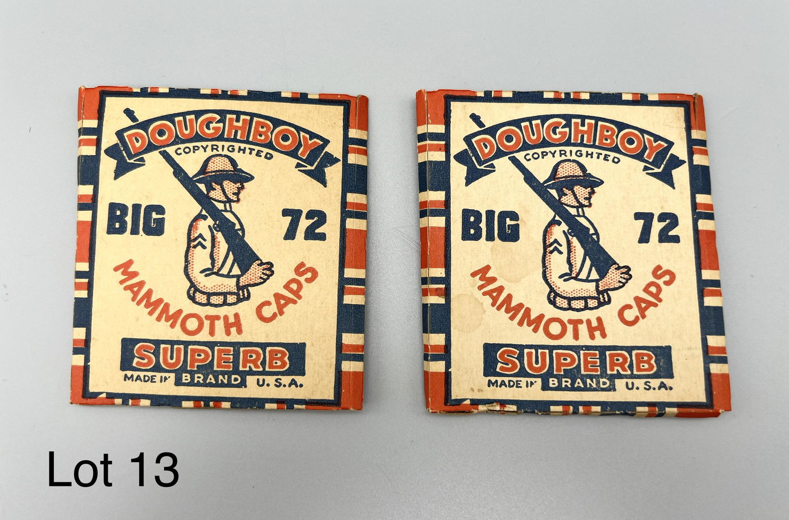 Pair of Doughboy Big 72 Mammoth Caps: Pair of Doughboy Big 72 Mammoth Caps, made by Superb. Includes several perforated sheets of caps, used in toy cap guns. Measures 3 1/4" x 3 1/2" *note- some sheets missing/torn, wear with age.