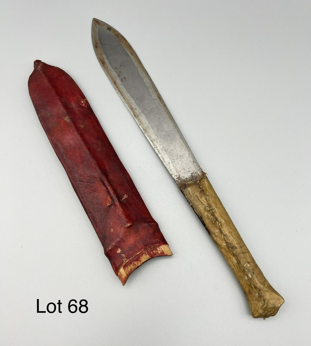 Handmade Leather Throwing Knife: Handmade mid century throwing knife with hand sewn leather and wood grip and sheath, sharp on both ends. Measures 12 1/4" long.