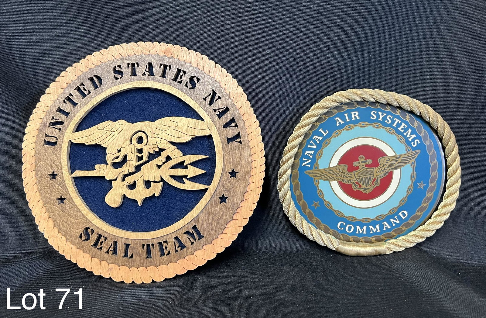 Pair of Decorative Naval Seals: Pair of decorative Naval seals. One reads Naval Air Systems Command, in metal with a rope edge. The other reads United States Navy Seal Team, all in wood with elaborate eagle design. First measures 7 