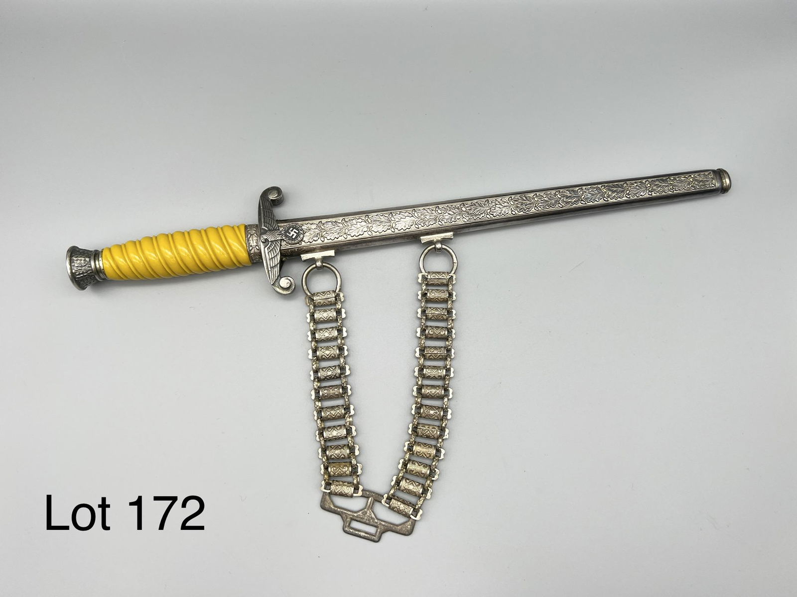 Fantasy German Infantry Heer Dagger: Fantasy German infantry Nazi heer dagger, reproduction with engraved blade and spiral grip. Good condition, comes with sheath and added chain. Measures 15 1/2" long