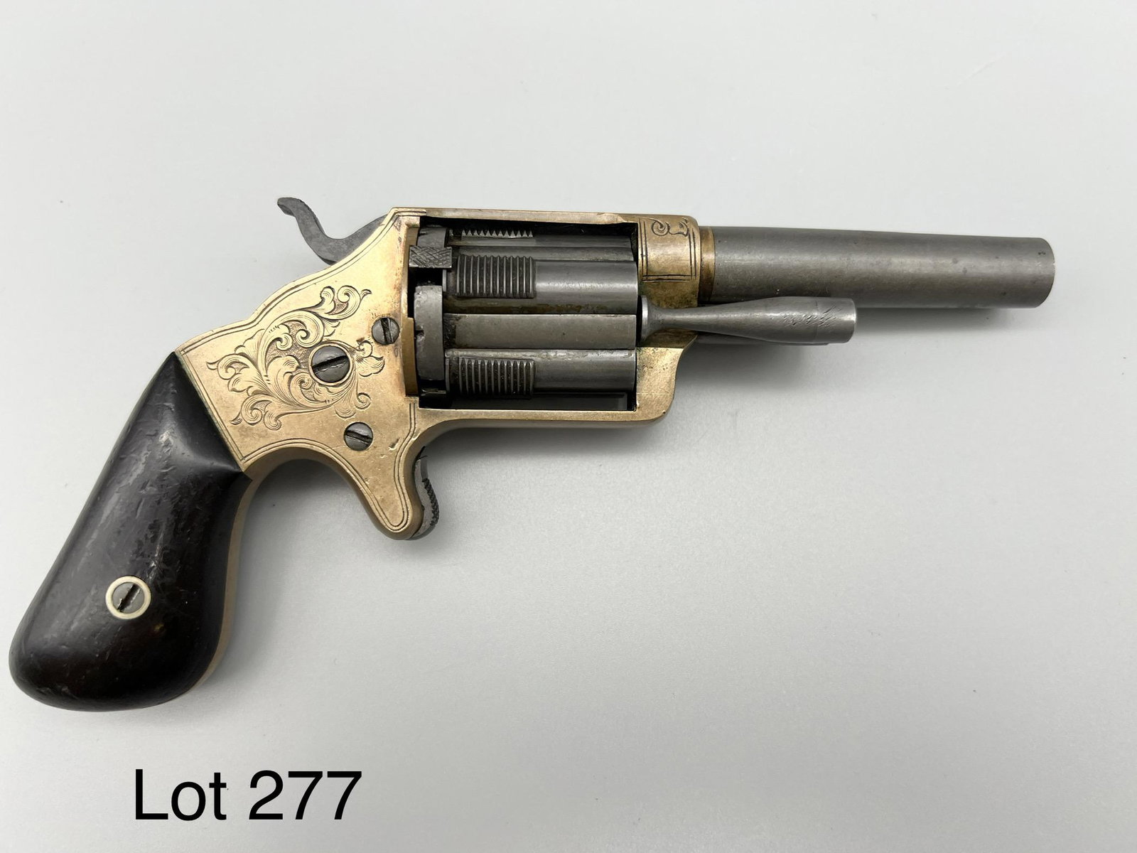 Antique Brooklyn Firearms Co. Pocket Revolver: Antique Brooklyn Firearms Co. front loading pocket revolver. Inlaid brass frame with dark wood handle, patent date on barrel April 14th, 1863. Unique trigger and sliding chamber mechanism, serial #406