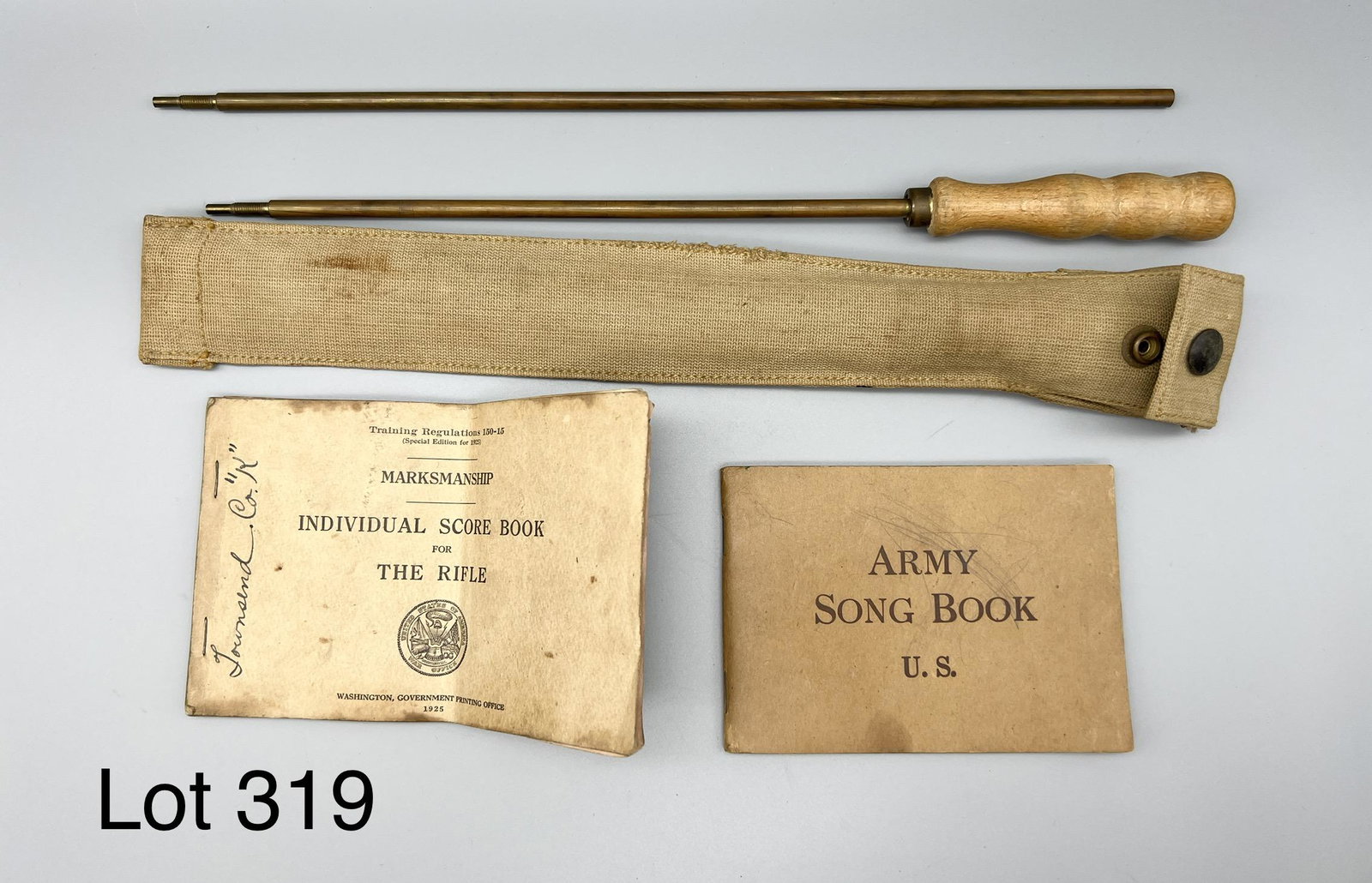 Mixed Lot of Early 20th Century Soldier's Effects: Mixed collection of early 20th century soldier's effects. Lot includes a two-piece cleaning rod, an Army Song Book dated 1918, and a Marksmanship Individual Score Book for The Rifle dated 1925. Score 