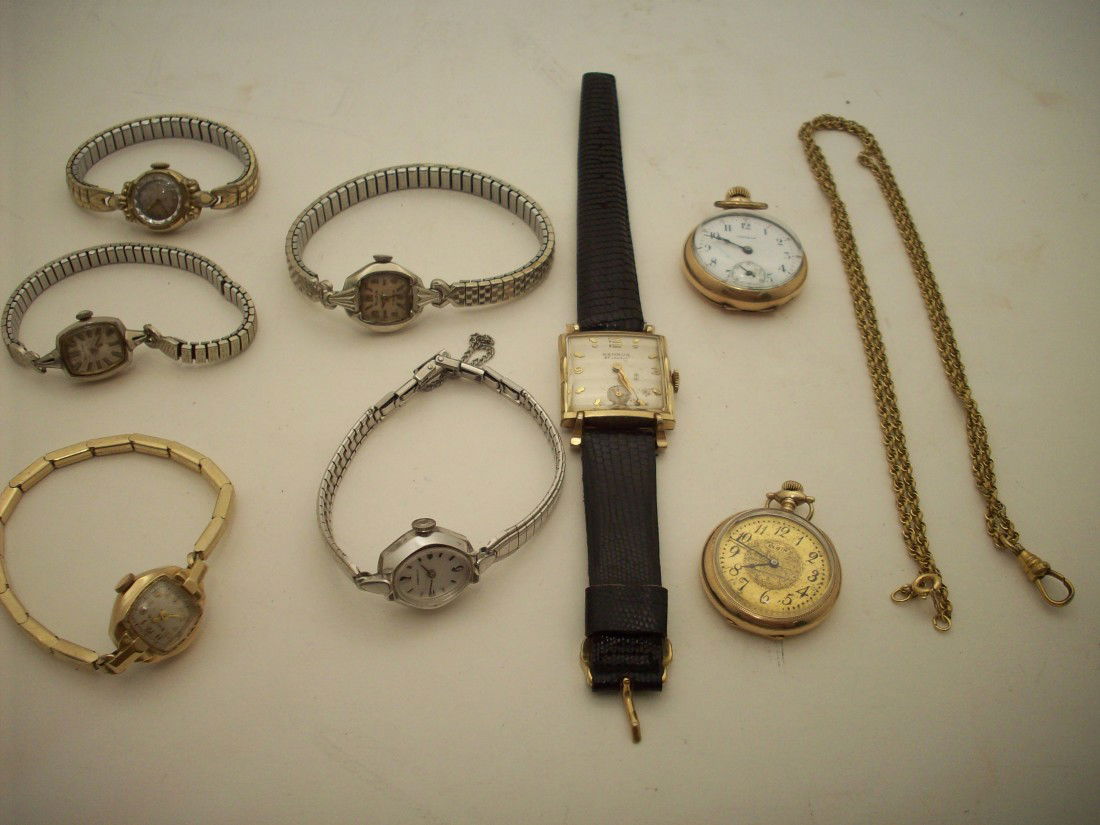 Tray Lot Of Watches: Eight watches and one watch chain. Ladies Wrist Watches: 2 Bulova and 1 Elgin in working condition, 1 Bulova and 1 Caraville non working. 1 Men's Benrus wrist watch in working condition. 1 Elgin and 1