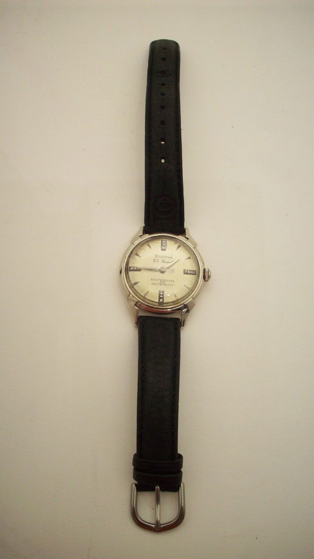 1955 Bulova Man's Wrist Watch: 23 Jewel movement, 14KT white gold case, Diamonds on the face at 12-3-6-9. Self winding, six adjustments, waterproof. Excellent working condition